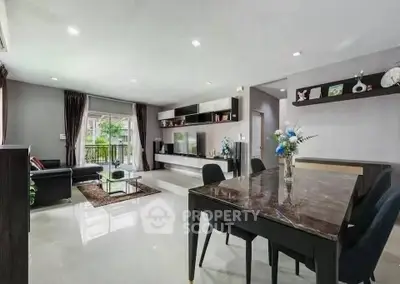 Spacious modern living room with elegant dining area and stylish decor