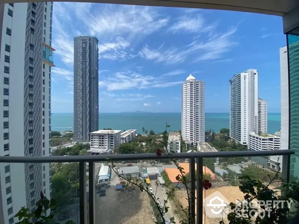 Stunning ocean view from high-rise balcony with modern cityscape