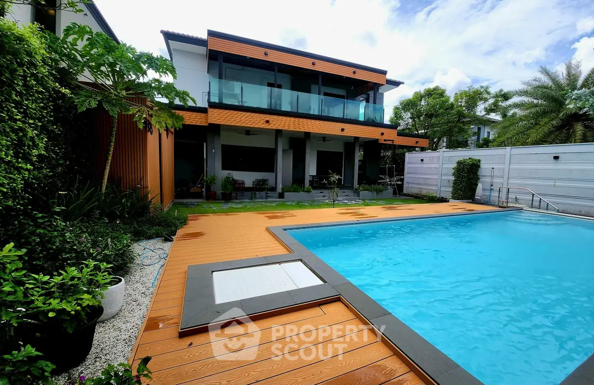 Luxurious modern home with private pool and spacious deck area.