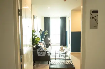Modern living room with stylish decor and natural light in a contemporary apartment.