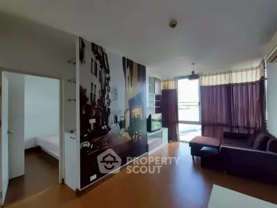 Modern living room with artistic wall mural and cozy seating area