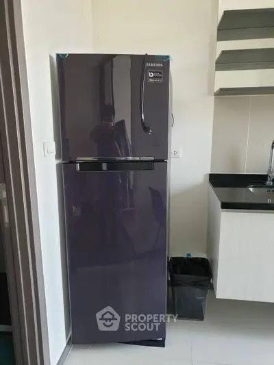 Modern kitchen with sleek Samsung refrigerator and stylish cabinetry