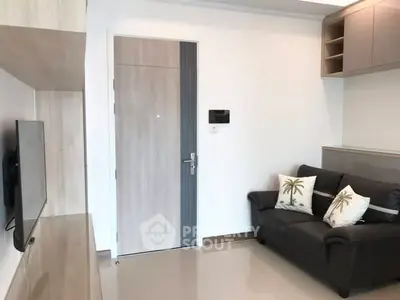 Modern living room with sleek design and cozy sofa