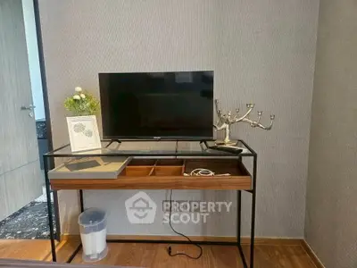Modern interior with sleek TV stand and decorative elements in a stylish room.