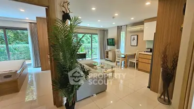 Modern open-plan living room with garden view and stylish decor