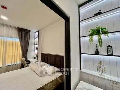 Modern bedroom with stylish decor and natural light