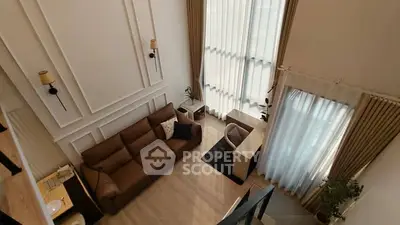 Spacious modern living room with high ceilings and elegant decor