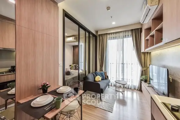 Modern living room with open layout and stylish decor in a cozy apartment.