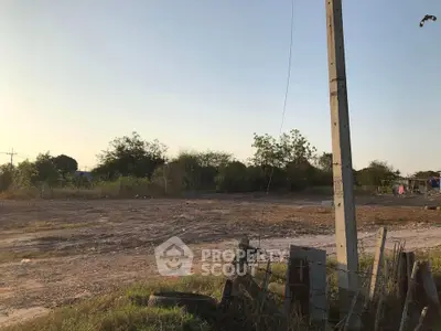 Vacant land with potential for development, surrounded by greenery and open sky, ideal for new construction.