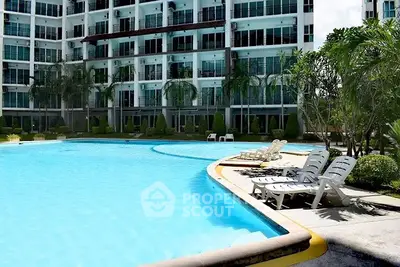 Luxurious apartment complex with inviting pool and lush greenery, perfect for relaxation and leisure.