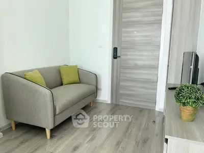 Modern living room with stylish sofa and wooden flooring