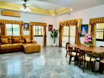 Spacious living room with elegant decor and ample natural light