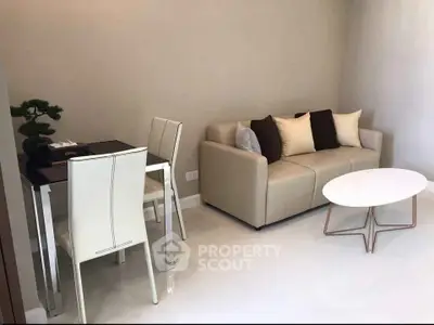 Modern living room with sleek furniture and neutral tones, perfect for cozy urban living.