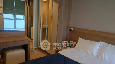 Cozy bedroom with ensuite bathroom and modern furnishings