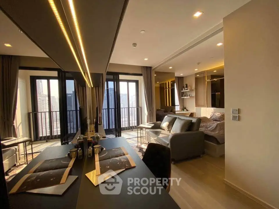 Modern studio apartment with open layout and city view, featuring sleek furnishings and ample natural light.
