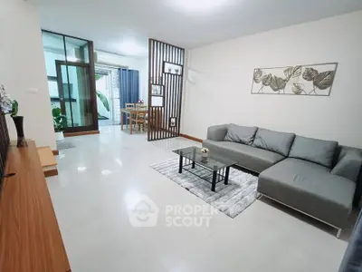 Spacious modern living room with sleek furniture and open layout