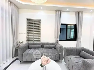Elegant living room with modern gray sofas and chic decor