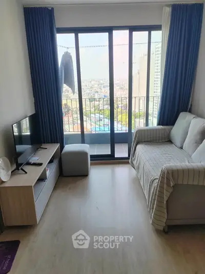 Modern living room with balcony view in high-rise apartment