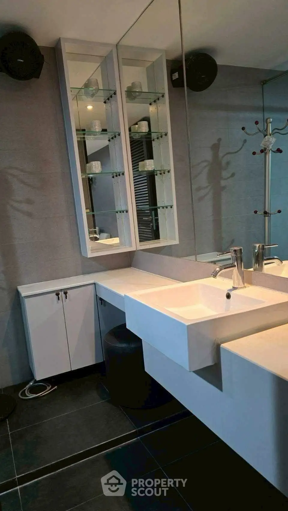 Modern bathroom with sleek vanity and large mirror
