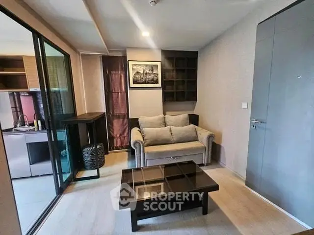 Modern living room with cozy sofa and stylish decor in a contemporary apartment.
