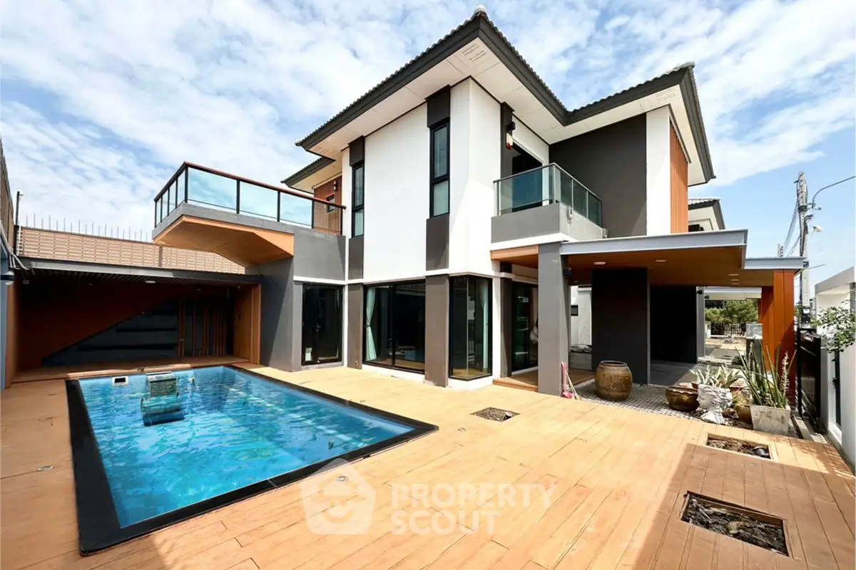 Modern luxury home with private pool and spacious balcony in a serene neighborhood.