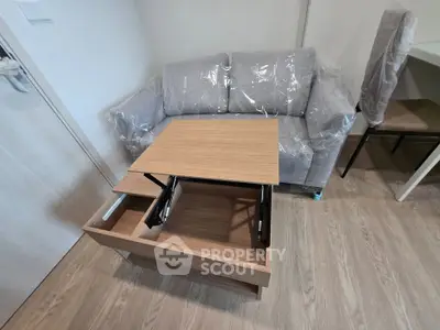 Modern living room with multifunctional coffee table and cozy sofa