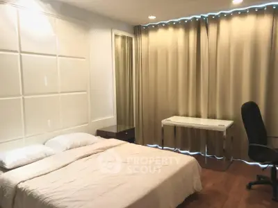 Spacious bedroom with modern decor and ample natural light