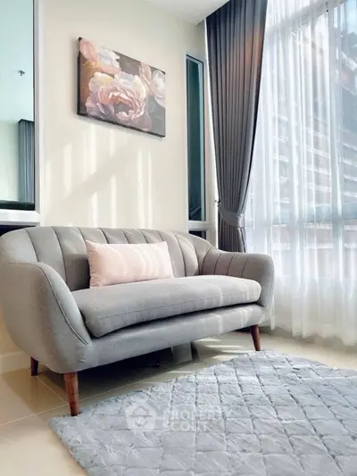 Stylish living room with elegant sofa and large window for natural light