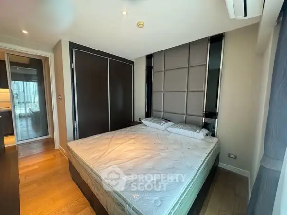 Modern bedroom with sleek design and large bed in a stylish apartment