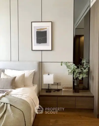 Elegant bedroom with modern decor and cozy ambiance, featuring stylish furniture and soft lighting.