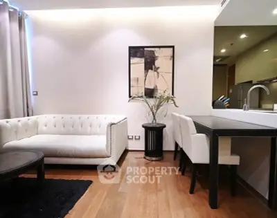 Modern living room with elegant white sofa and stylish dining area