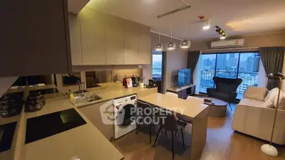 Modern open-layout kitchen and living room with city view in luxury apartment