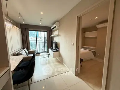 Modern apartment interior with open living and dining area, featuring a city view from the balcony.