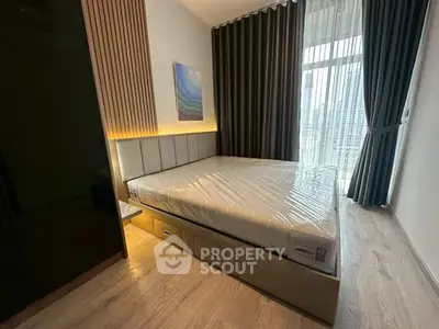 Modern bedroom with large window and stylish decor