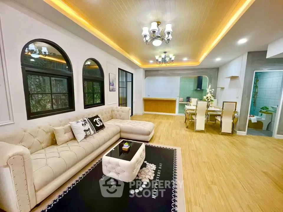 Luxurious open living room with elegant decor and modern lighting