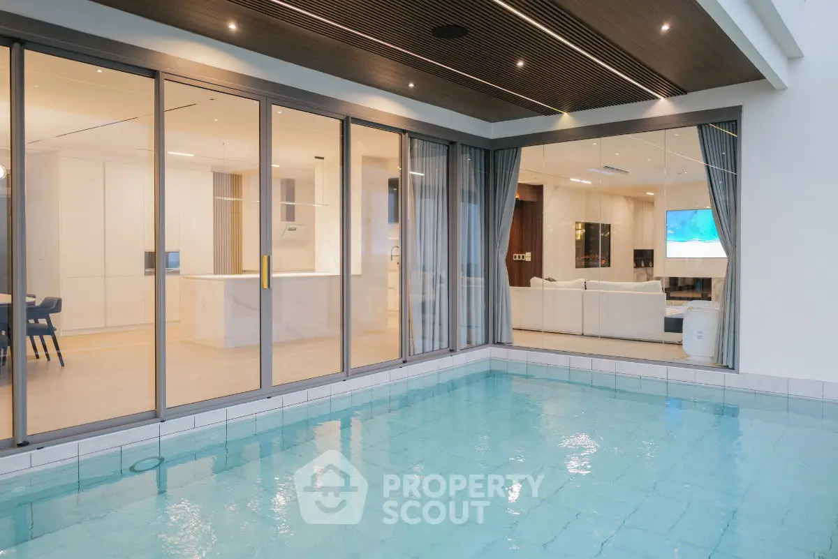 Luxurious modern home with indoor pool and elegant interior design.