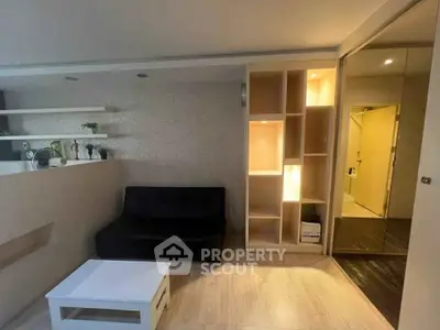 Modern living room with sleek design and built-in shelving, perfect for urban living.