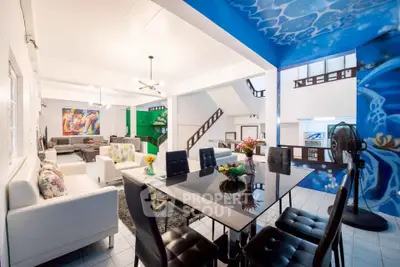 Spacious modern living and dining area with vibrant decor and open layout