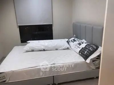 Cozy bedroom with modern decor and comfortable bed in a stylish apartment.