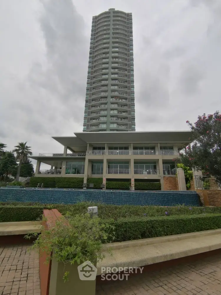 Stunning high-rise building with lush landscaping and modern architecture.