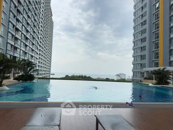 Luxurious high-rise apartment with stunning infinity pool and ocean view.