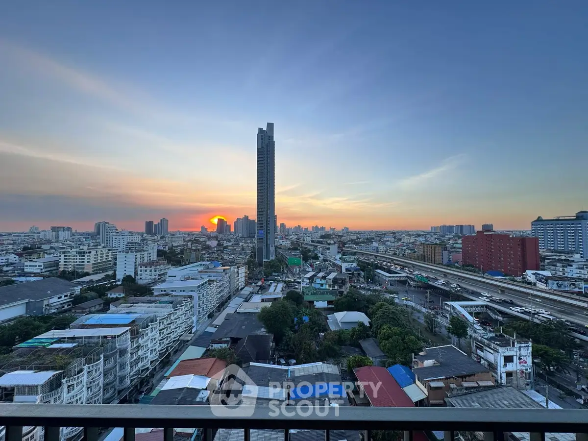 Stunning cityscape view at sunset with high-rise building and sprawling urban landscape.