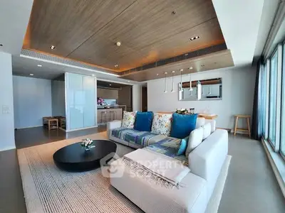 Luxurious modern living room with open kitchen and panoramic windows