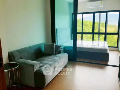 Modern studio apartment with glass partition and scenic view