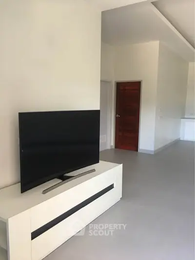 Modern living room with sleek TV setup and minimalist design