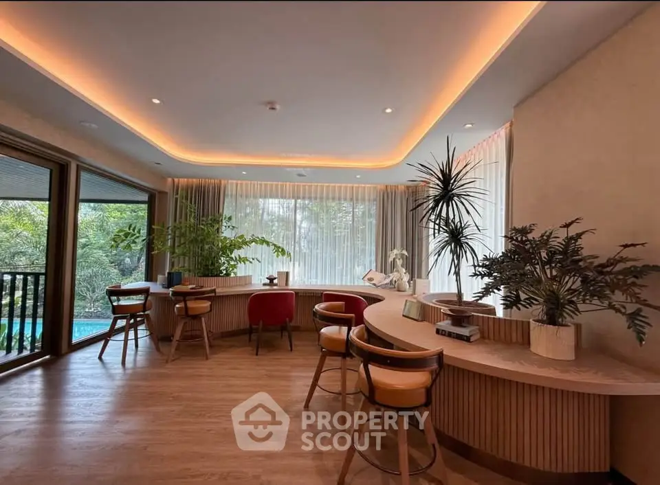 Luxurious modern living room with elegant lighting and lush garden view