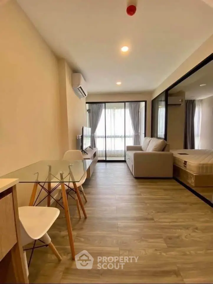 Modern living room with open layout and stylish furniture in a cozy apartment.