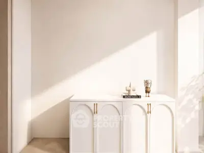 Elegant minimalist interior with white cabinet and decorative accents