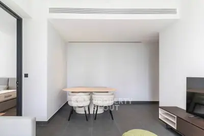 Modern minimalist living room with sleek furniture and neutral tones, perfect for contemporary living.