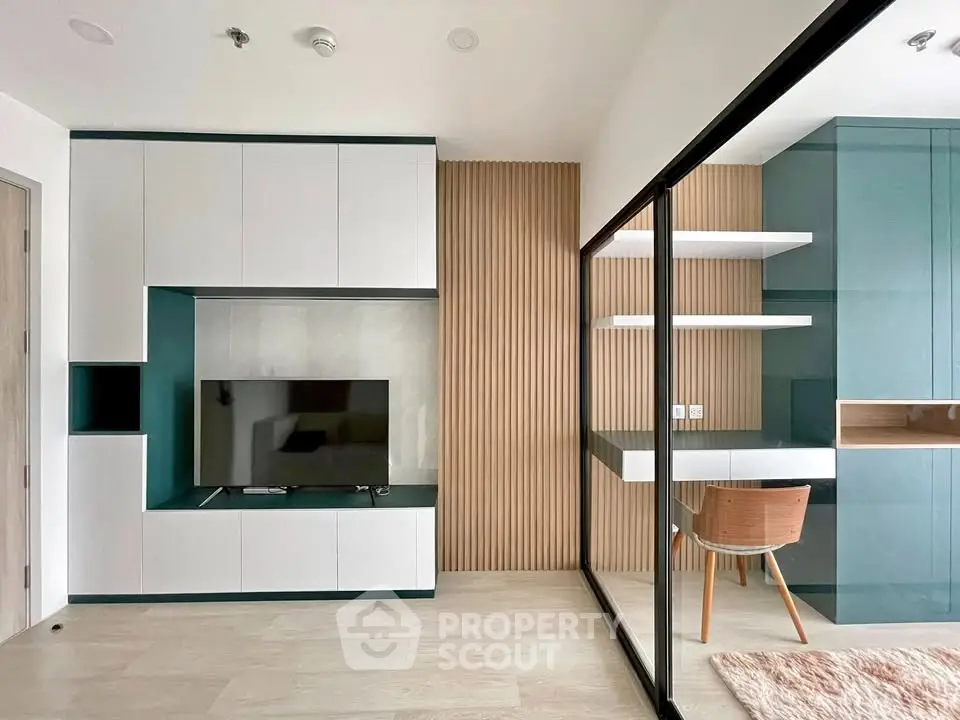 Modern living room with sleek TV unit and stylish study area